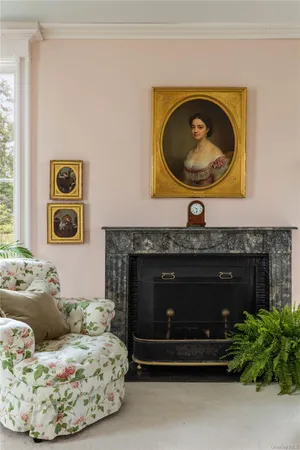 a living room with a couch and a fireplace