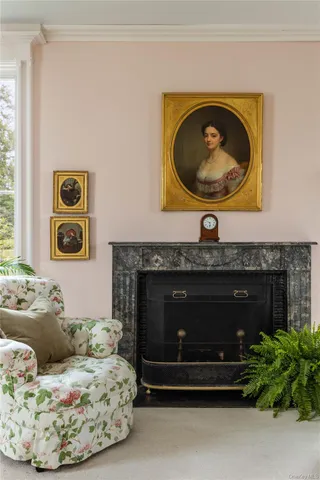 a living room with a couch and a fireplace