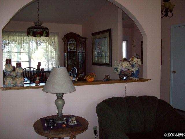 4075 Alcorn Road Fallon, NV 89406 - Photo 4 of 9 a living room with furniture and a chandelier