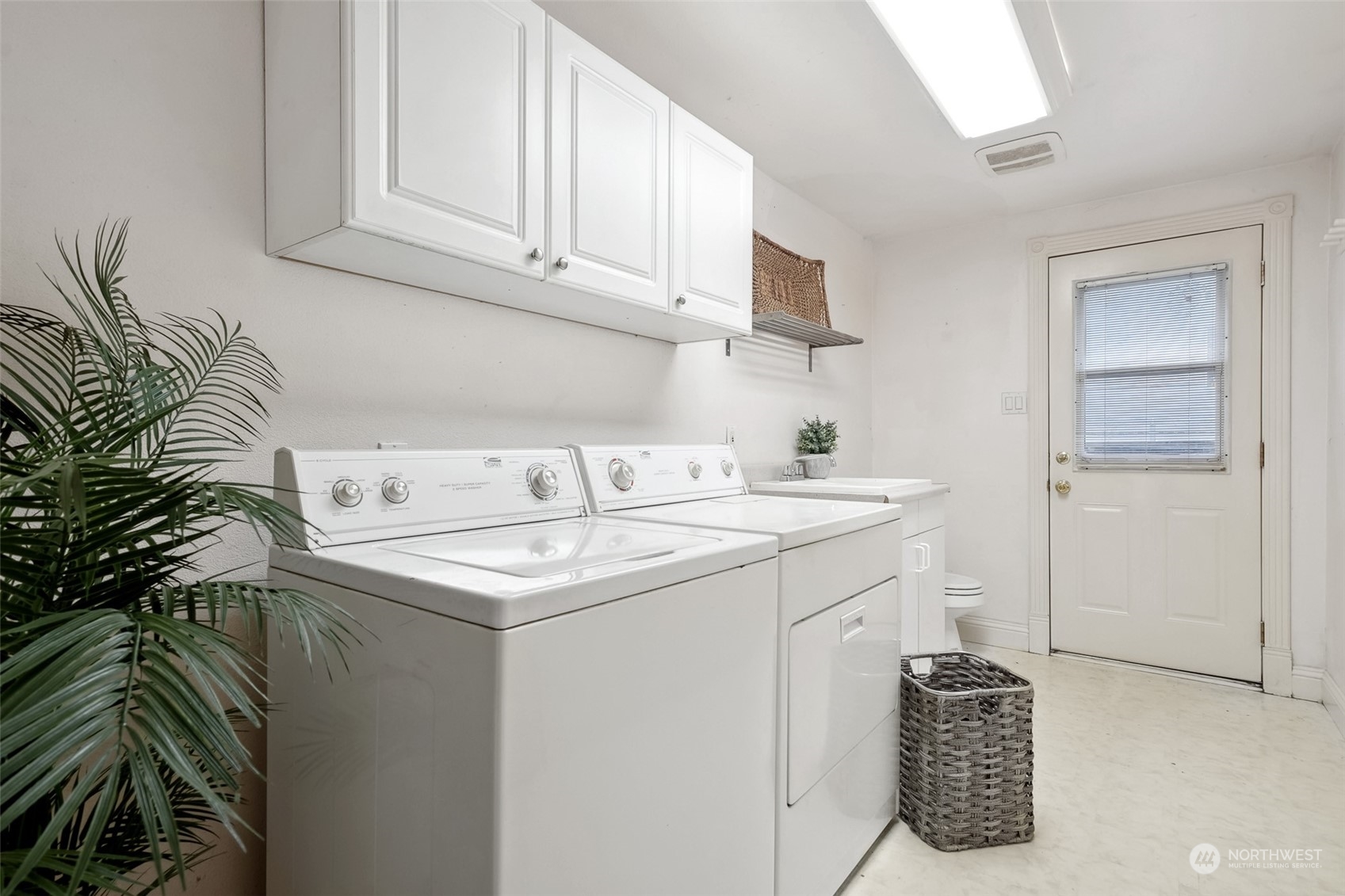 10810 Southeast 182nd Street Renton, WA 98055 - Photo 19 of 24 a utility room with sink dryer and washer