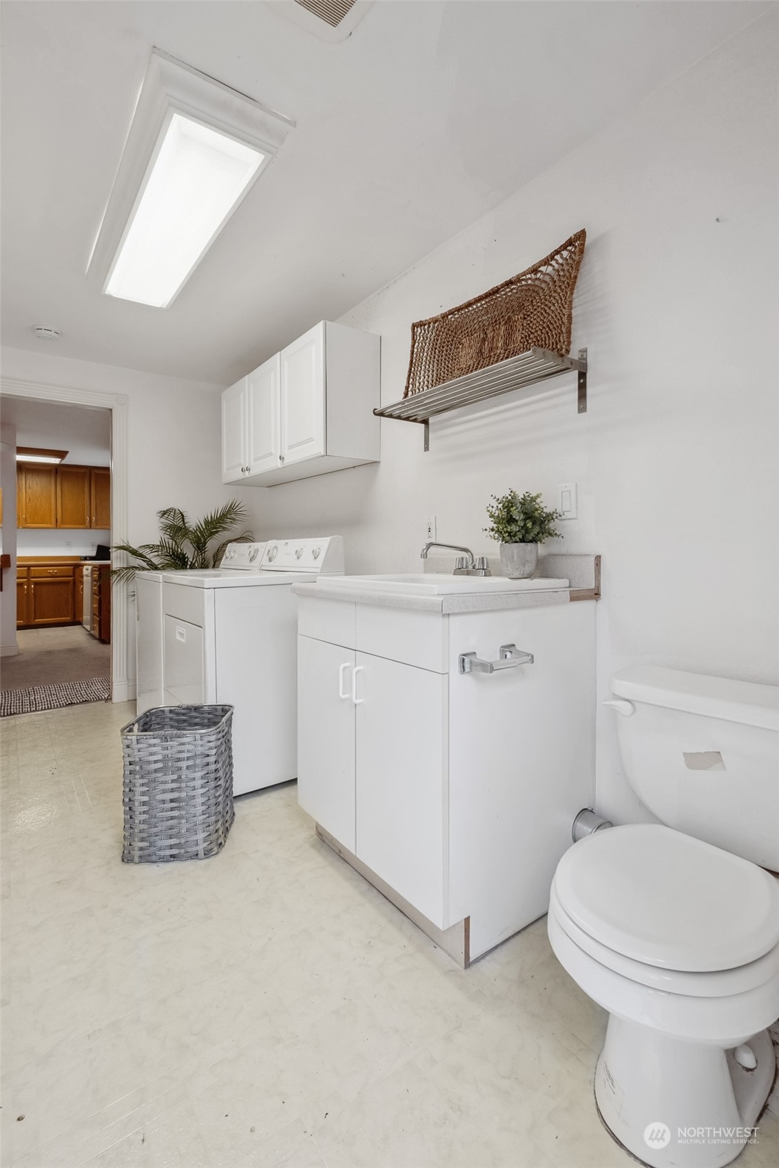 10810 Southeast 182nd Street Renton, WA 98055 - Photo 20 of 24 a bathroom with a toilet a sink and a mirror