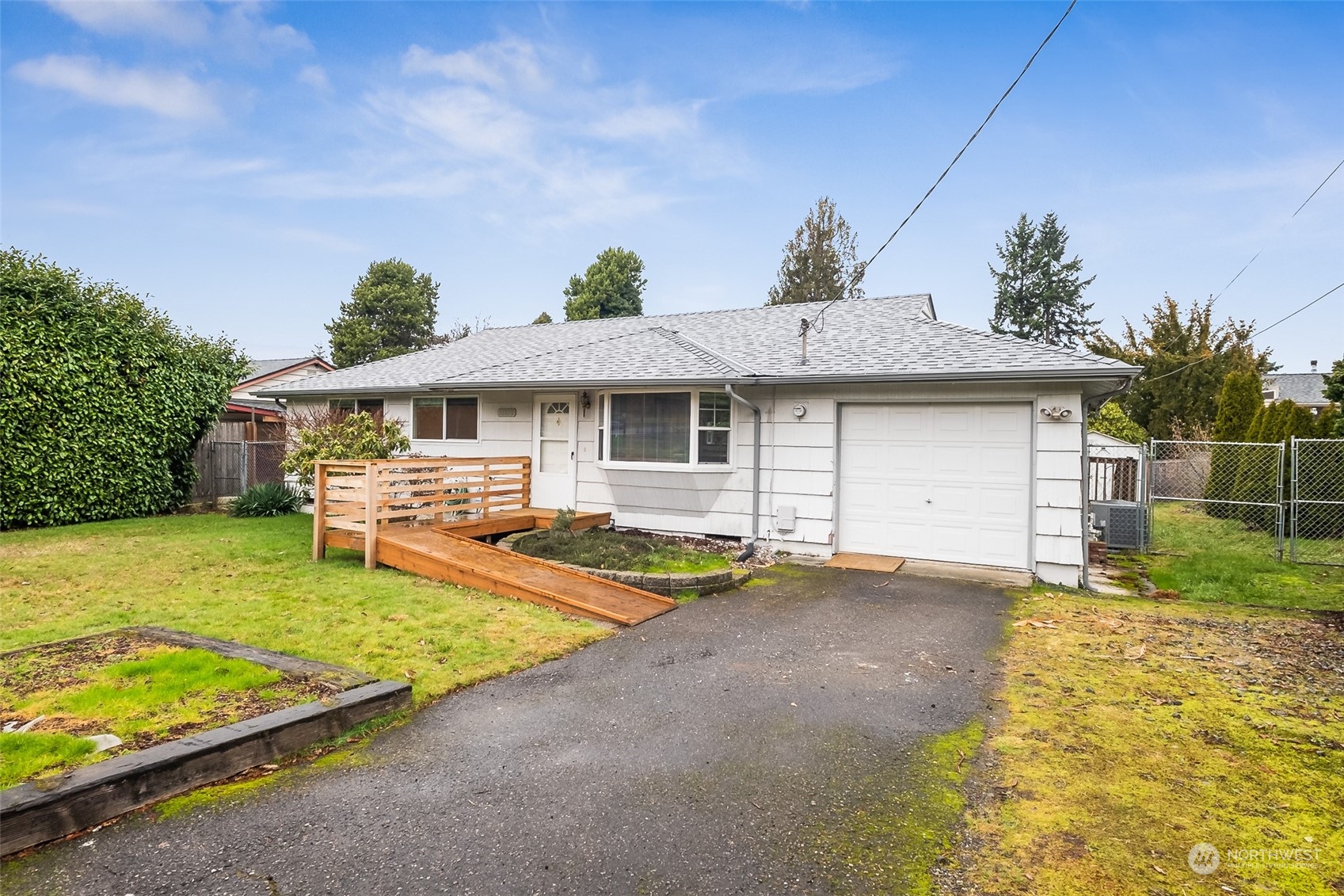 10810 Southeast 182nd Street Renton, WA 98055 - Photo 2 of 24 a view of a house with pool table and chairs under an umbrella