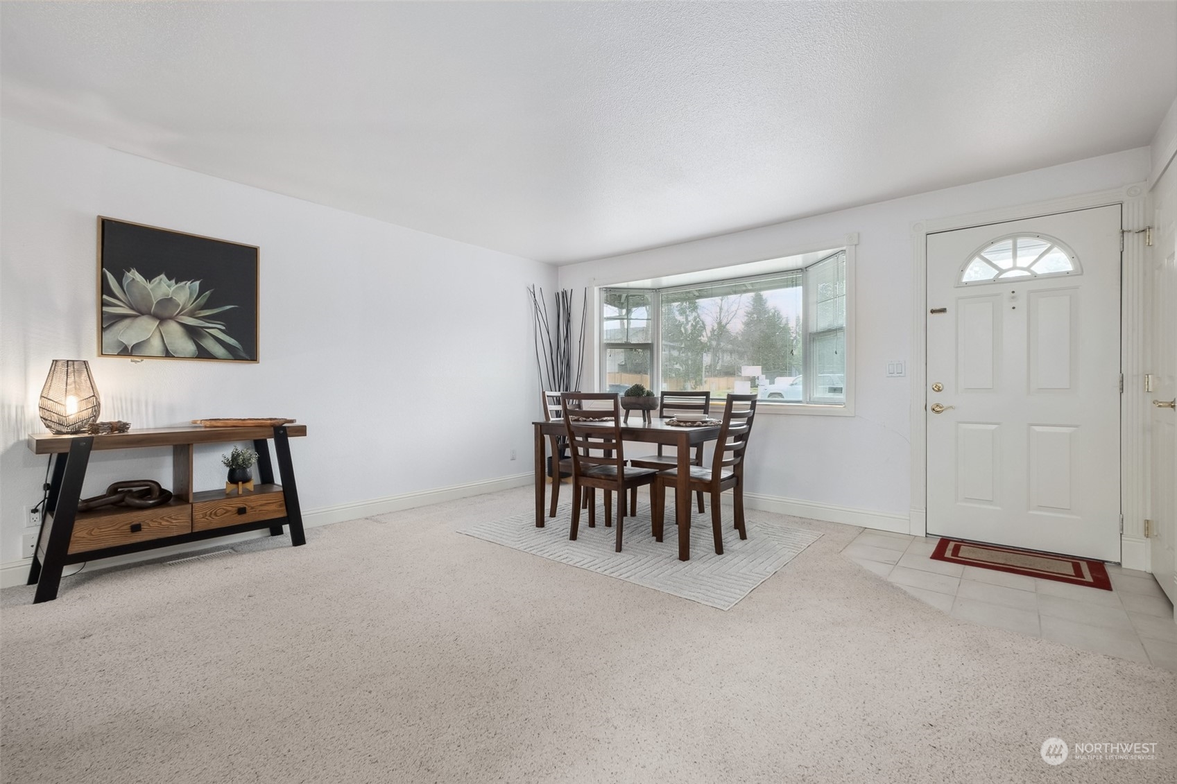 10810 Southeast 182nd Street Renton, WA 98055 - Photo 4 of 24 a dining room with furniture and a floor to ceiling window