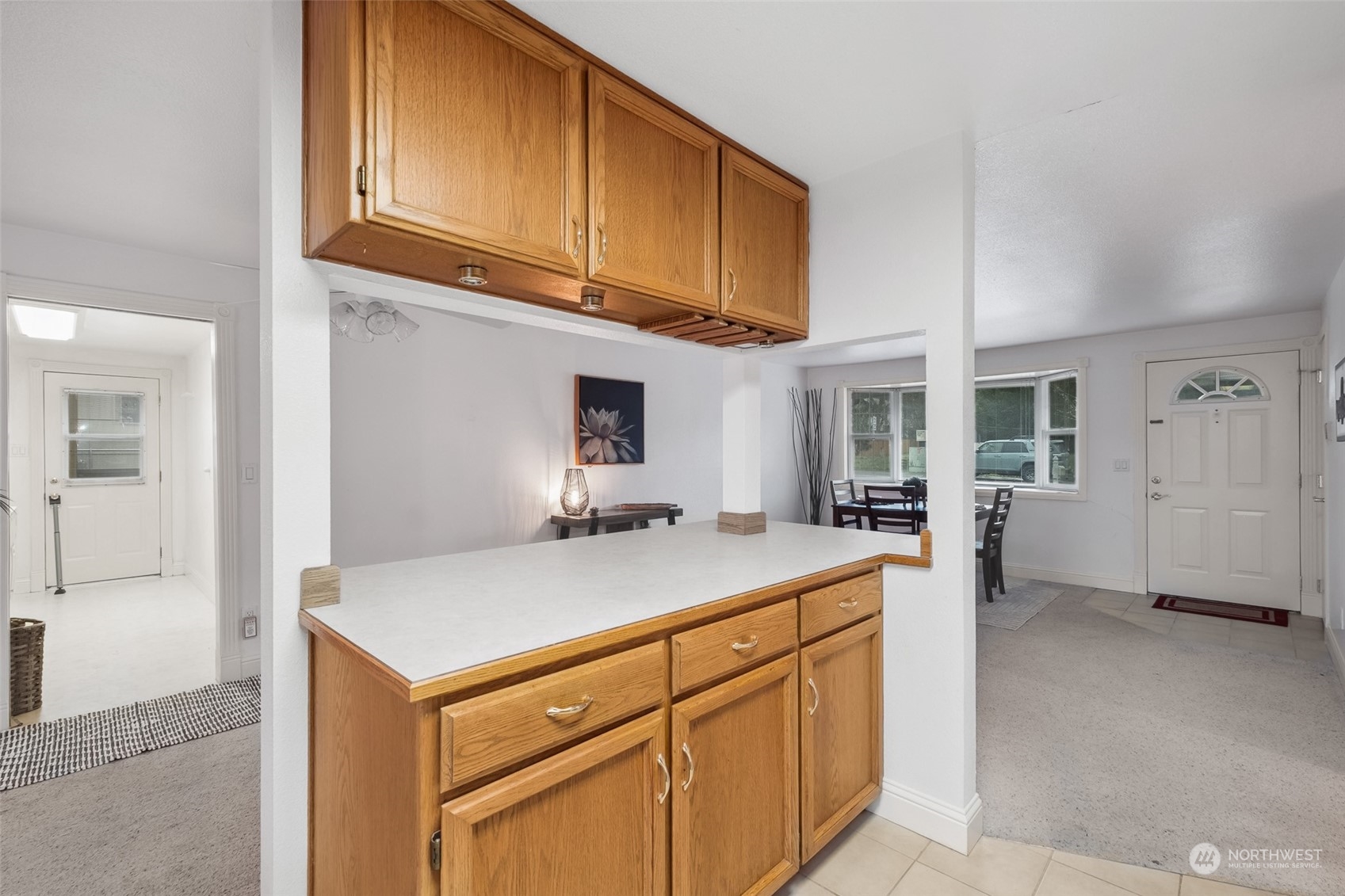 10810 Southeast 182nd Street Renton, WA 98055 - Photo 8 of 24 a kitchen with stainless steel appliances granite countertop a sink and cabinets