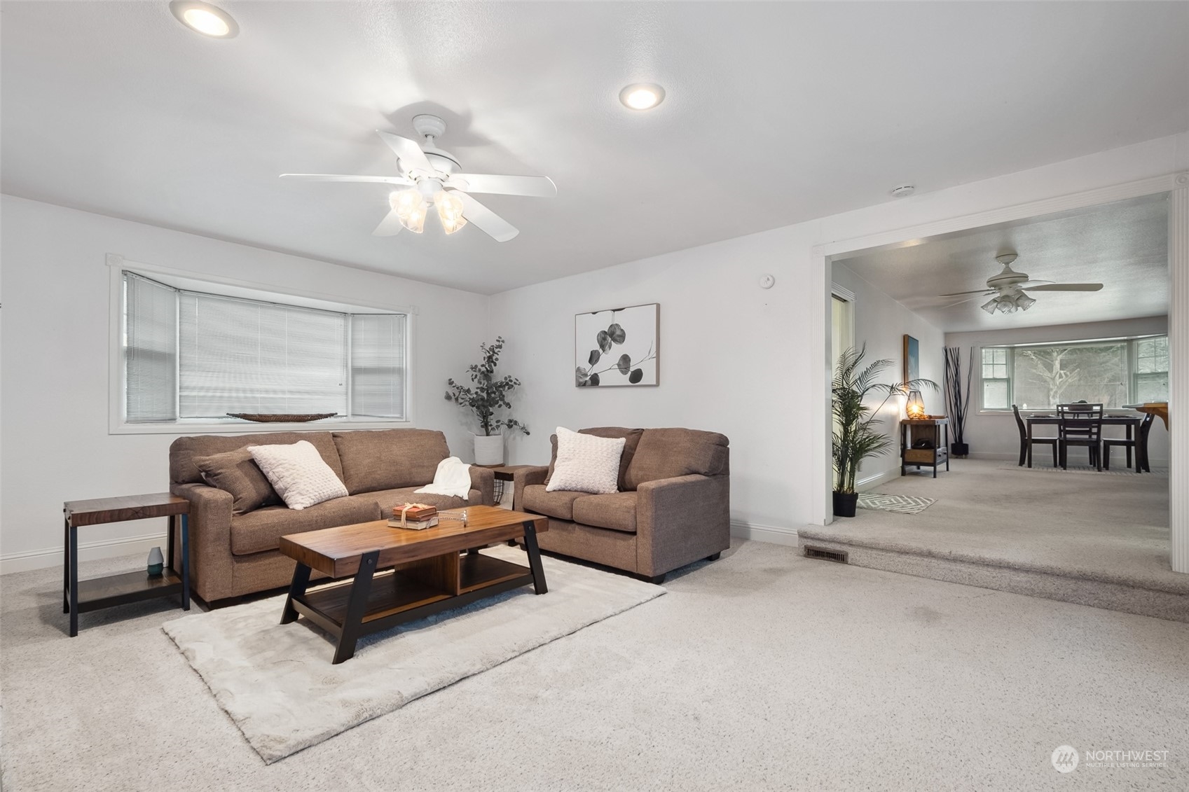 10810 Southeast 182nd Street Renton, WA 98055 - Photo 10 of 24 a living room with furniture and a chandelier