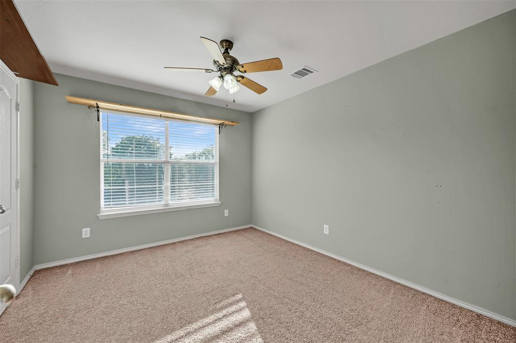9017 Graywolf Ridge Trail Fort Worth, TX 76244 - Photo 13 of 27 Empty room featuring carpet flooring and ceiling fan