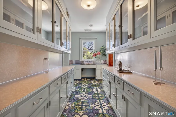a kitchen with stainless steel appliances granite countertop a sink and cabinets