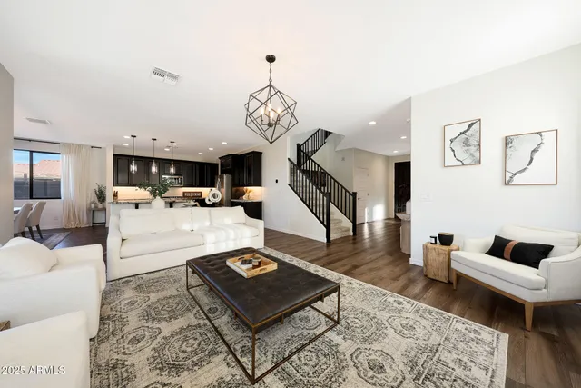 a bathroom with a granite countertop sink mirror and shower