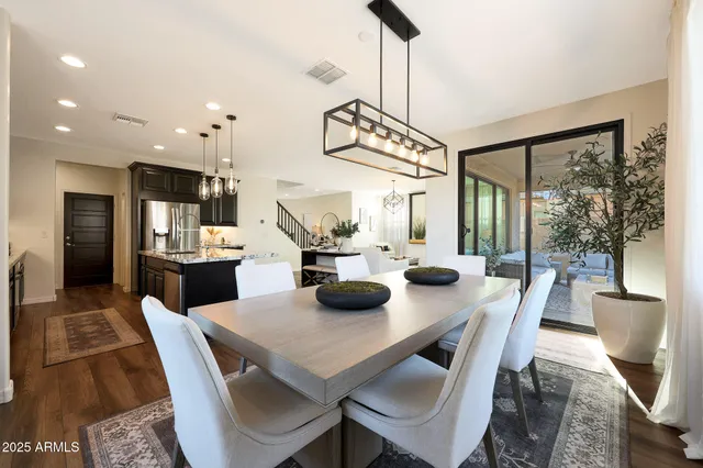 a bathroom with a double vanity sink toilet and a mirror
