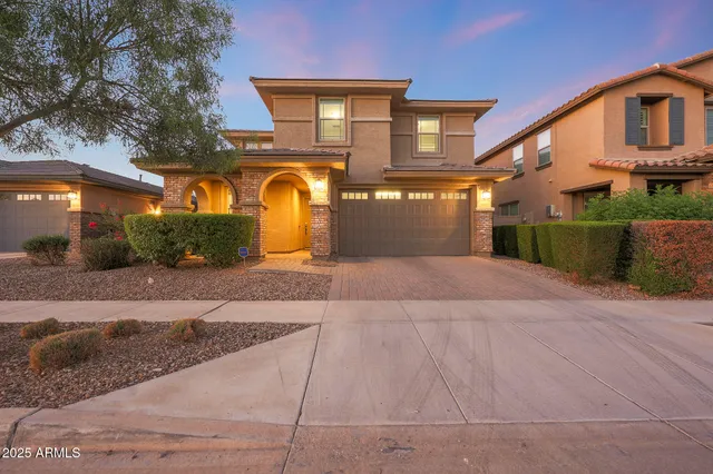 a view of a house with a yard and sitting area