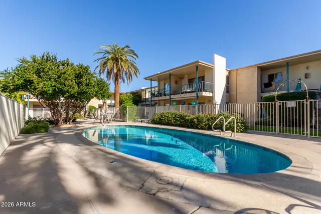 a view of swimming pool in front of house