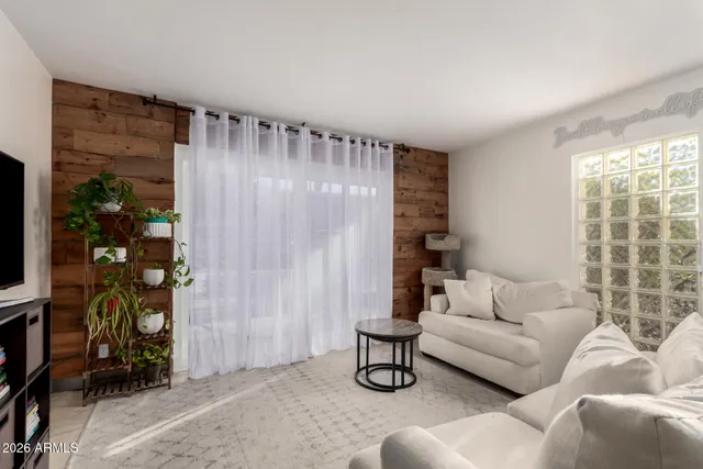 a living room with furniture and a window