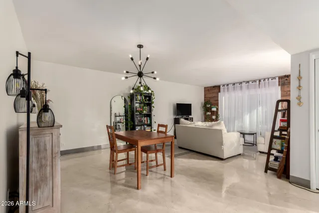 a dining room with furniture and entryway