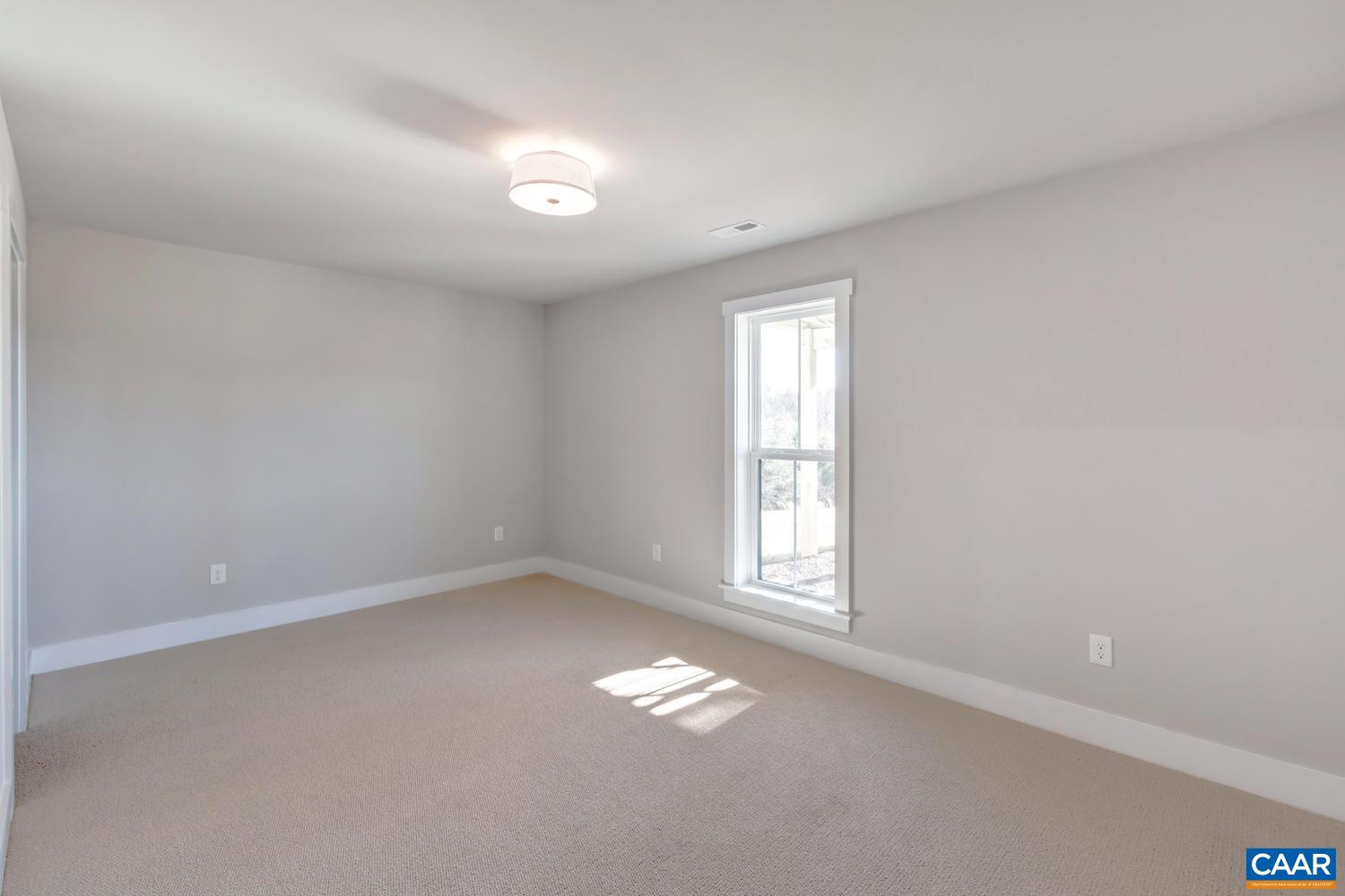 1140 Riparian Court Charlottesville, VA 22911 - Photo 43 of 57 an empty room with a window
