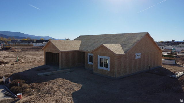 4973 North 900 East Enoch, UT 84721 - Photo 2 of 8 View of front of home with a mountain view and a residential view