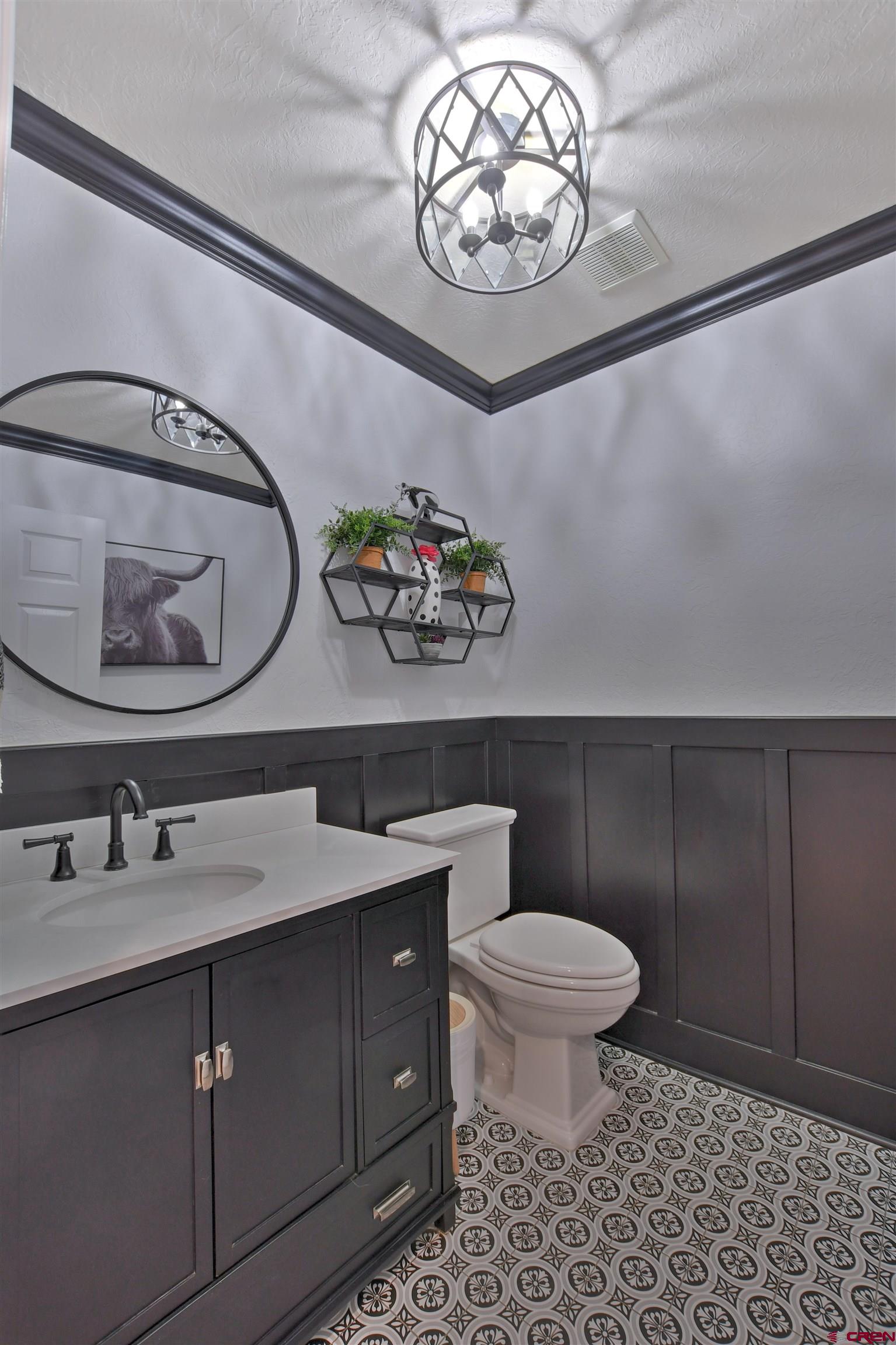 602 Chipeta Drive Ridgway, CO 81432 - Photo 11 of 41 a bathroom with a sink a toilet and a mirror