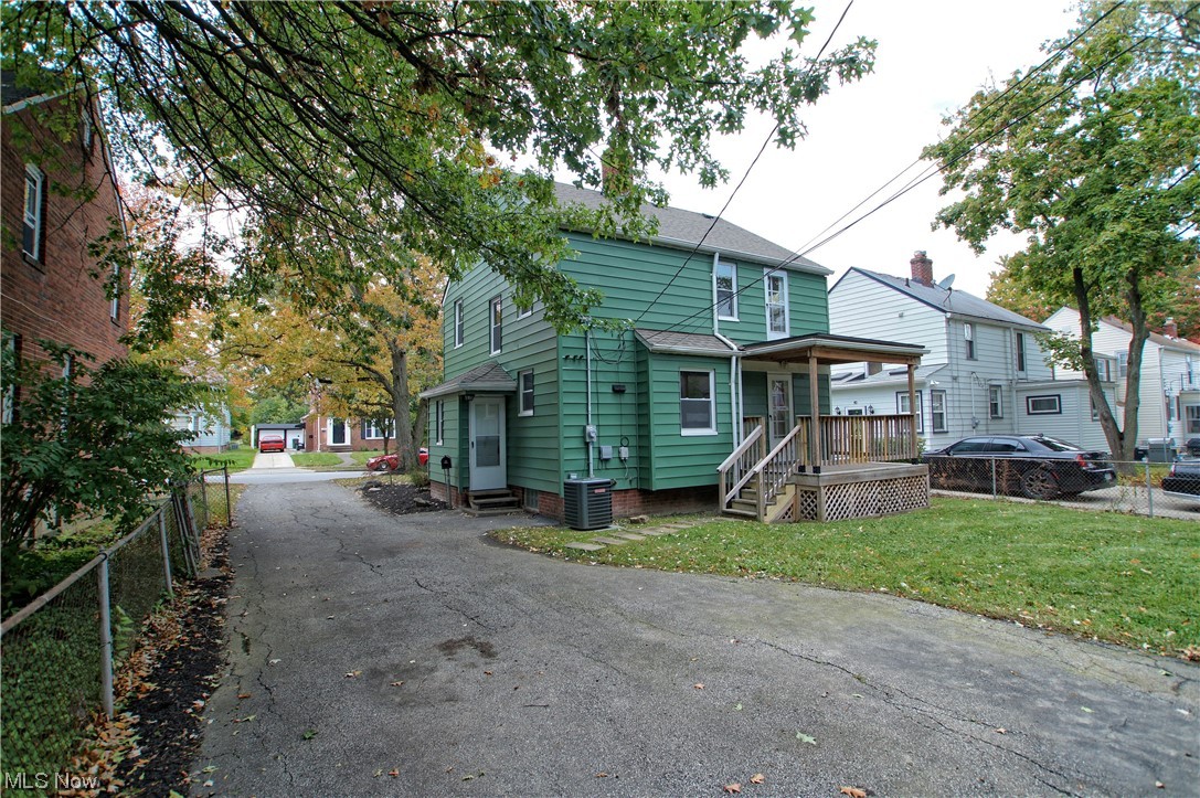 1387 Winston Road Cleveland, OH 44121 - Photo 5 of 29 View of front of property featuring a front yard and central air condition unit