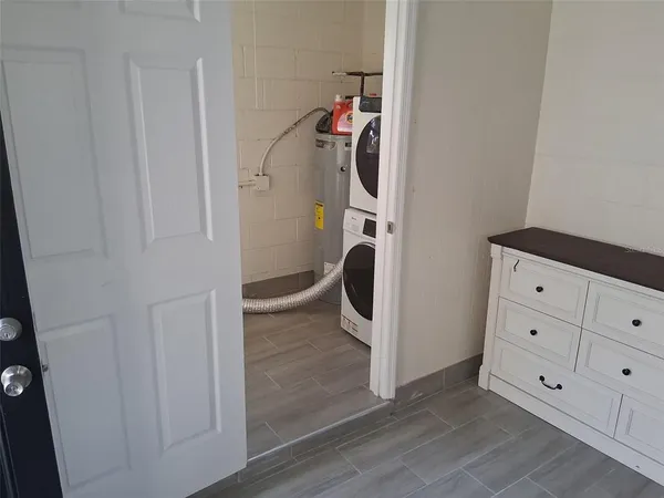 a view of a storage & utility room with closet