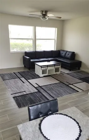 a living room with a couch and window