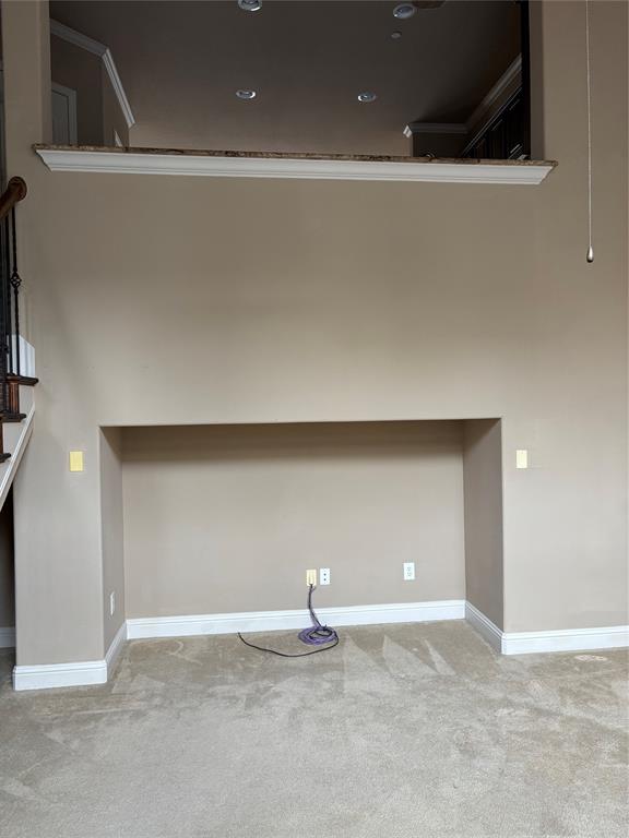 5748 Robbie Road Plano, TX 75024 - Photo 7 of 32 TV niche and second floor open to the living room