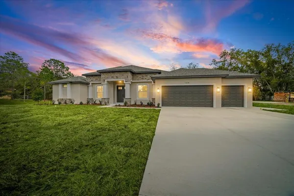 front view of a house with a yard