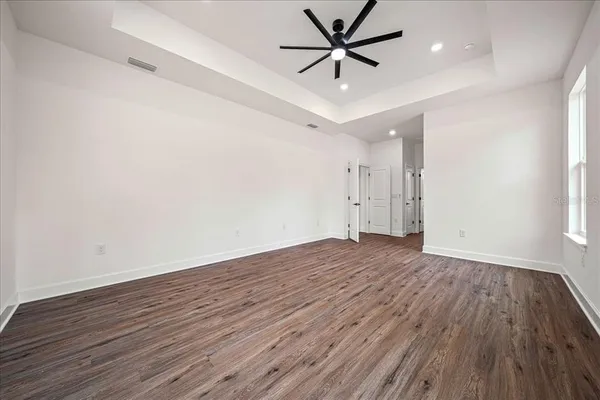 a spacious bathroom with double vanity sinks and a mirror