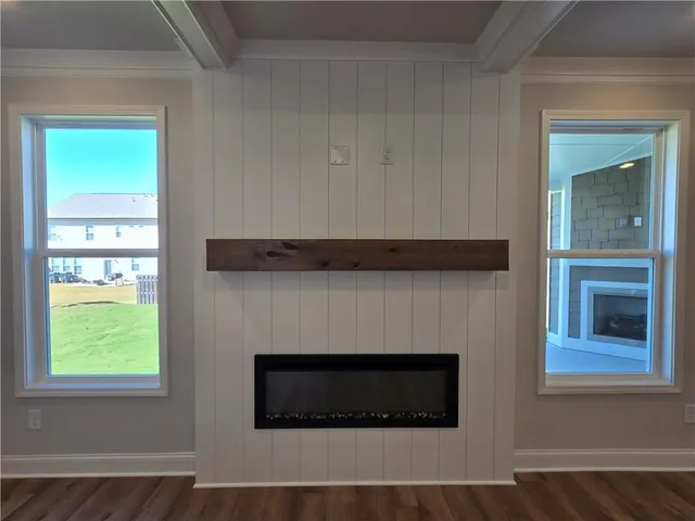 a living room with a fireplace and a window