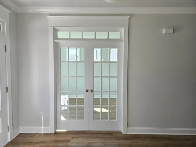a view of wooden floor and a window