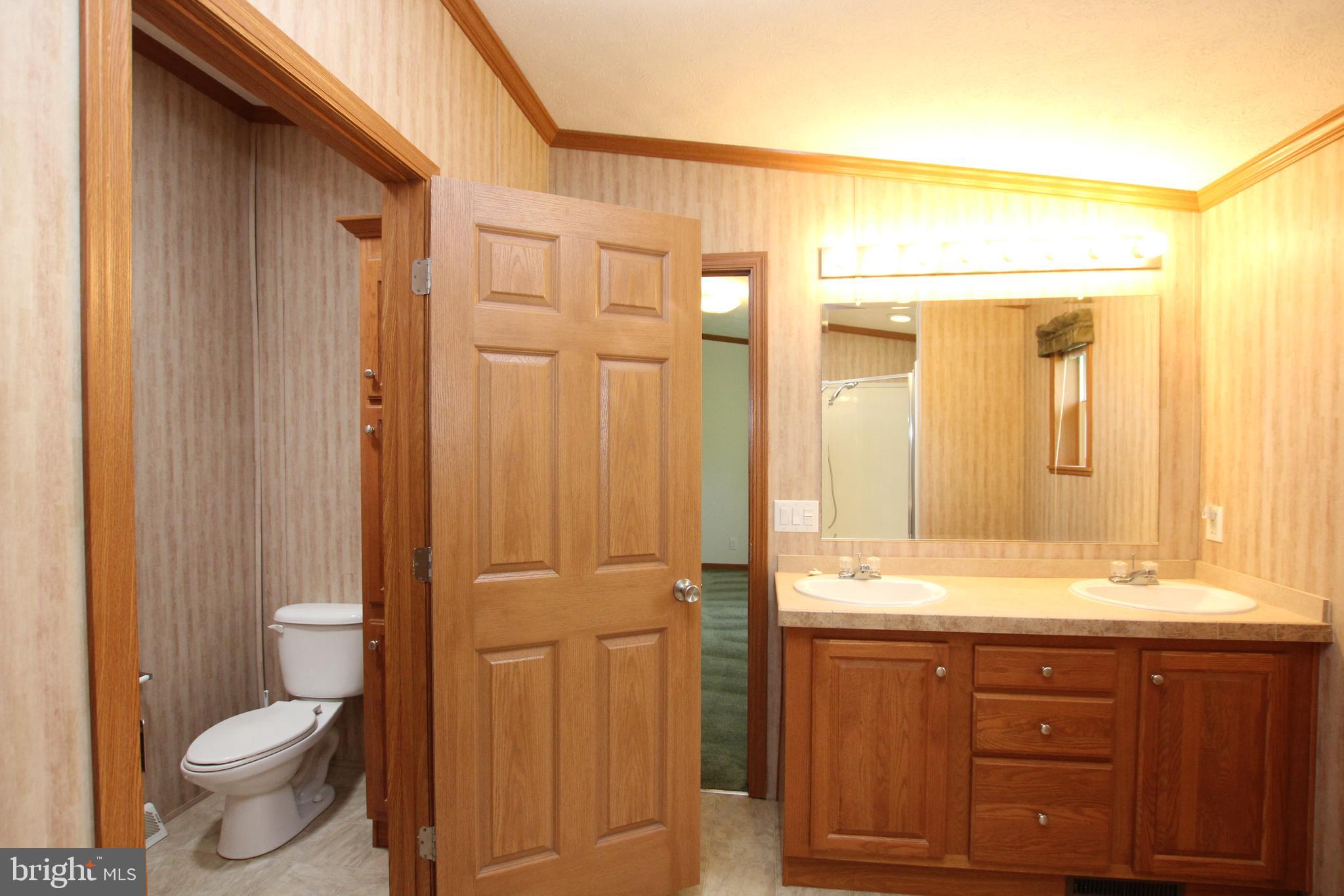 372 Vernon Road Harrington, DE 19952 - Photo 12 of 19 Sep. room w/toilet & linen Closet