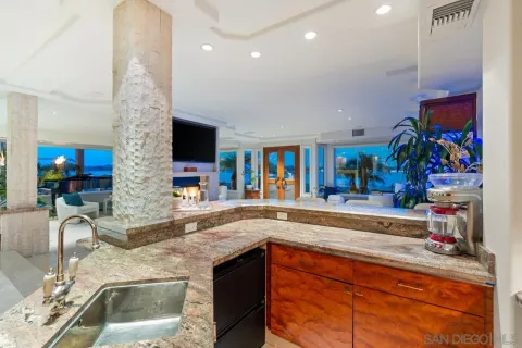 a bedroom with a bed a ceiling fan and a flat screen tv