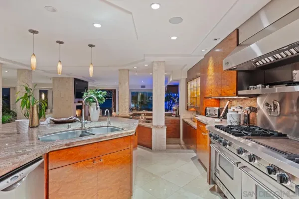 a bathroom with a granite countertop sink a large mirror and a shower
