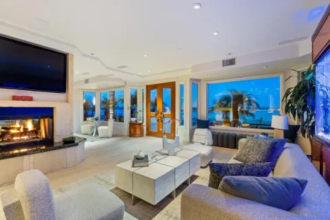 a living room with fireplace furniture and a flat screen tv