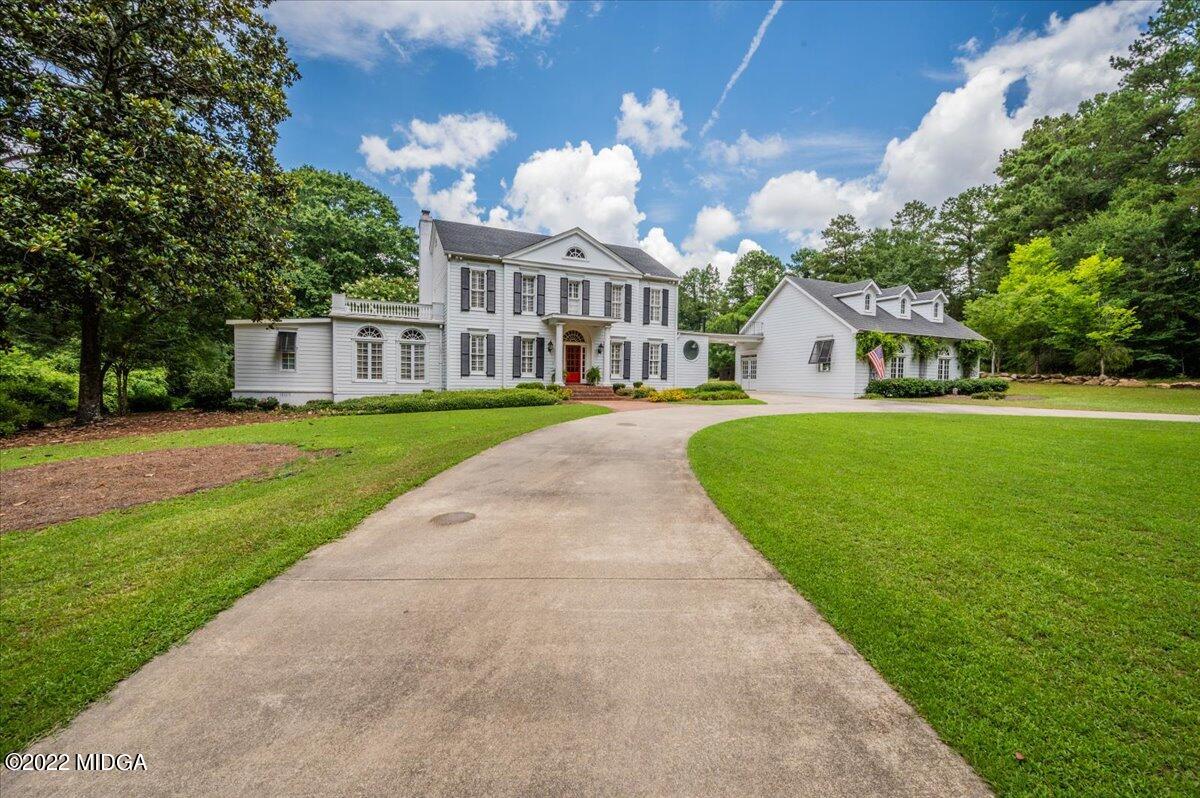 788 Bass Road Macon, GA 31210 - Photo 1 of 71 a front view of a house with a garden and trees