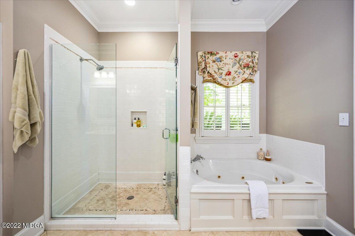 788 Bass Road Macon, GA 31210 - Photo 17 of 71 a bathroom with a bathtub and a shower