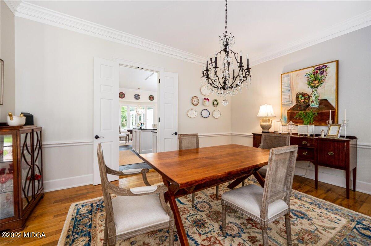 788 Bass Road Macon, GA 31210 - Photo 18 of 71 a view of a dining room with furniture and wooden floor