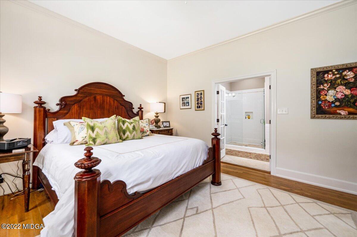 788 Bass Road Macon, GA 31210 - Photo 25 of 71 a bed room with a bed and painting on the wall