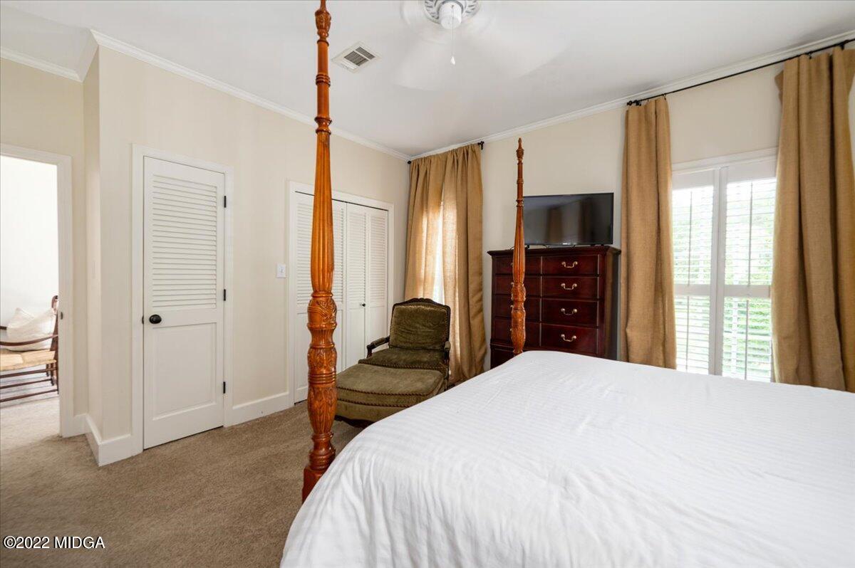 788 Bass Road Macon, GA 31210 - Photo 37 of 71 a bedroom with a bed and a flat tv screen