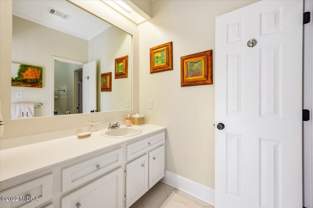 788 Bass Road Macon, GA 31210 - Photo 38 of 71 a spacious bathroom with a double vanity sink a mirror and a shower