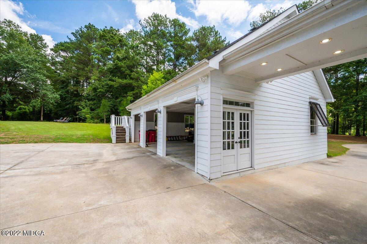 788 Bass Road Macon, GA 31210 - Photo 42 of 71 a view of a house with a backyard and a garage