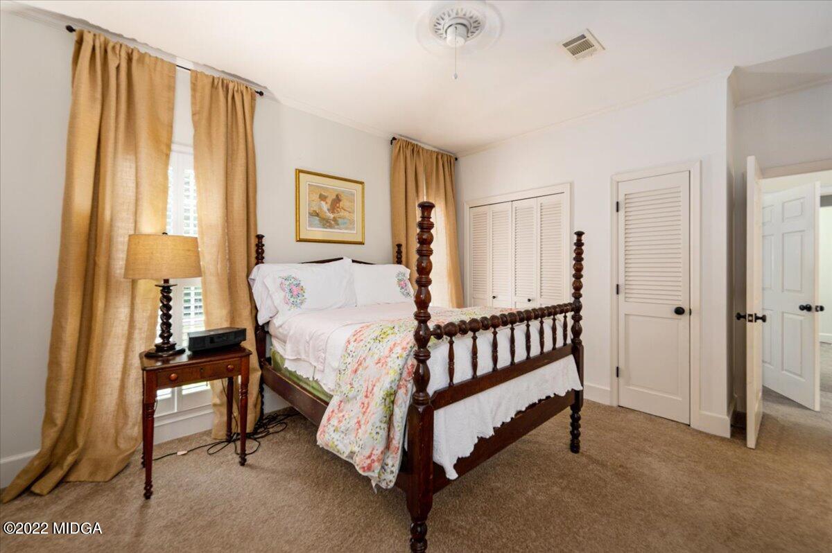 788 Bass Road Macon, GA 31210 - Photo 43 of 71 a spacious bedroom with a bed and a window