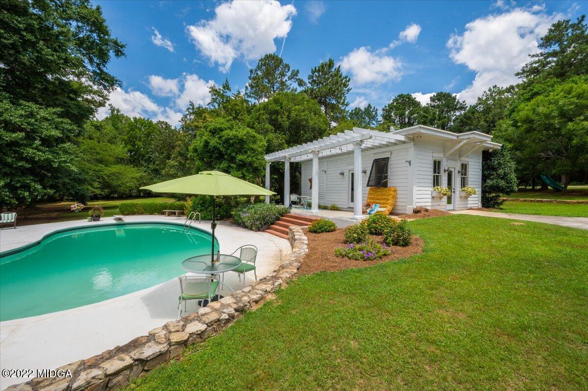 788 Bass Road Macon, GA 31210 - Photo 6 of 71 a view of a house with backyard sitting area and garden