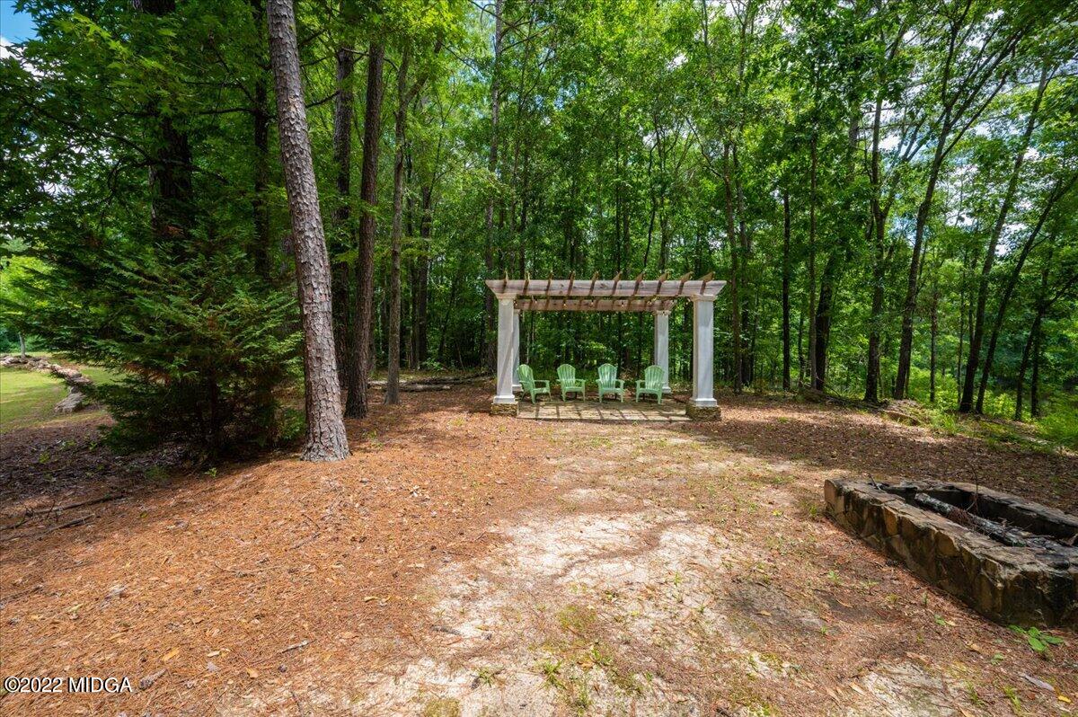 788 Bass Road Macon, GA 31210 - Photo 67 of 71 a backyard of a house with large trees and plants