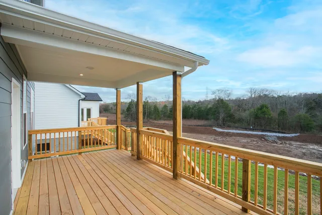 a view of a balcony with wooden floor