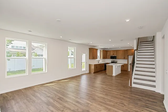 a kitchen with sink a microwave and refrigerator