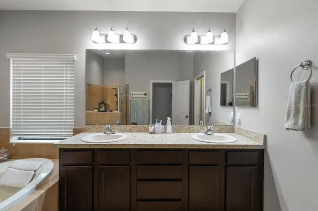 a bathroom with a tub and a shower
