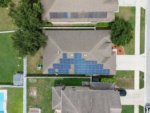 a aerial view of a house with a garden and plants
