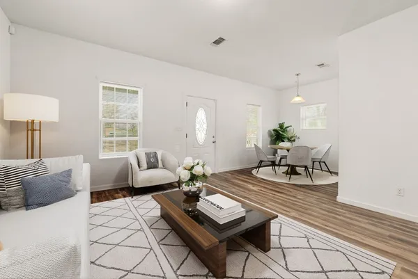 a living room with furniture and a table