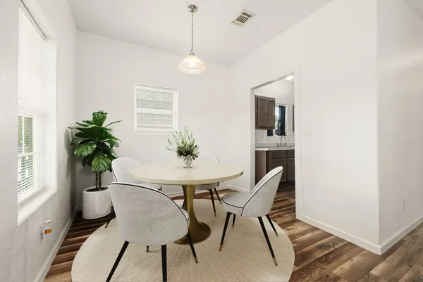 a view of a workspace with furniture and a potted plant