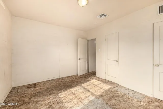 an empty room with windows