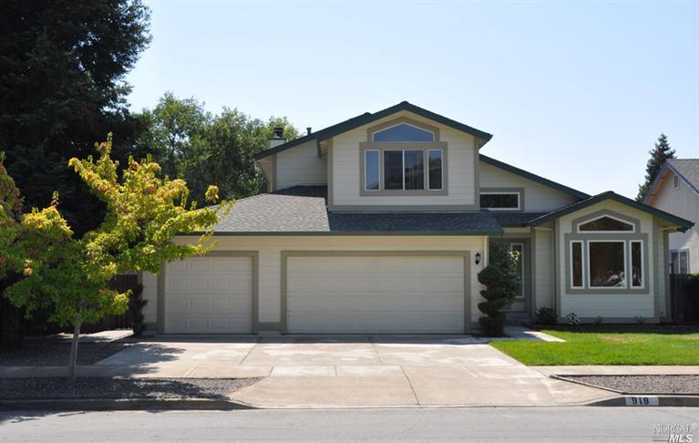 919 Baird Road Santa Rosa, CA 95409 - Photo 1 of 1 a front view of a house with a yard and garage